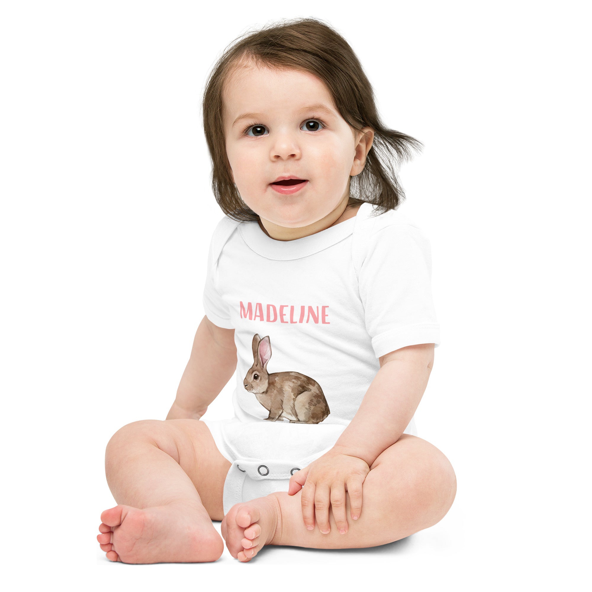 Baby wearing a white baby bunny one piece