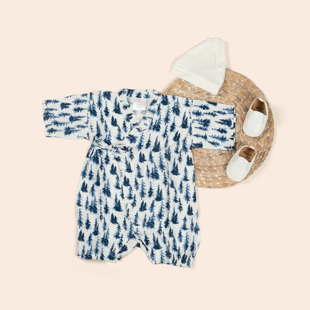 Baby jumpsuit in with blue forest design