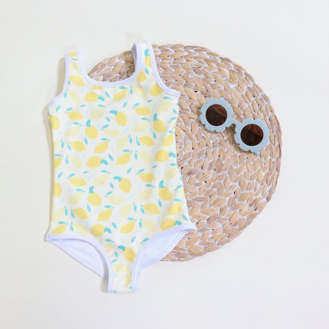 Kids swimsuit with cute summer lemon pattern