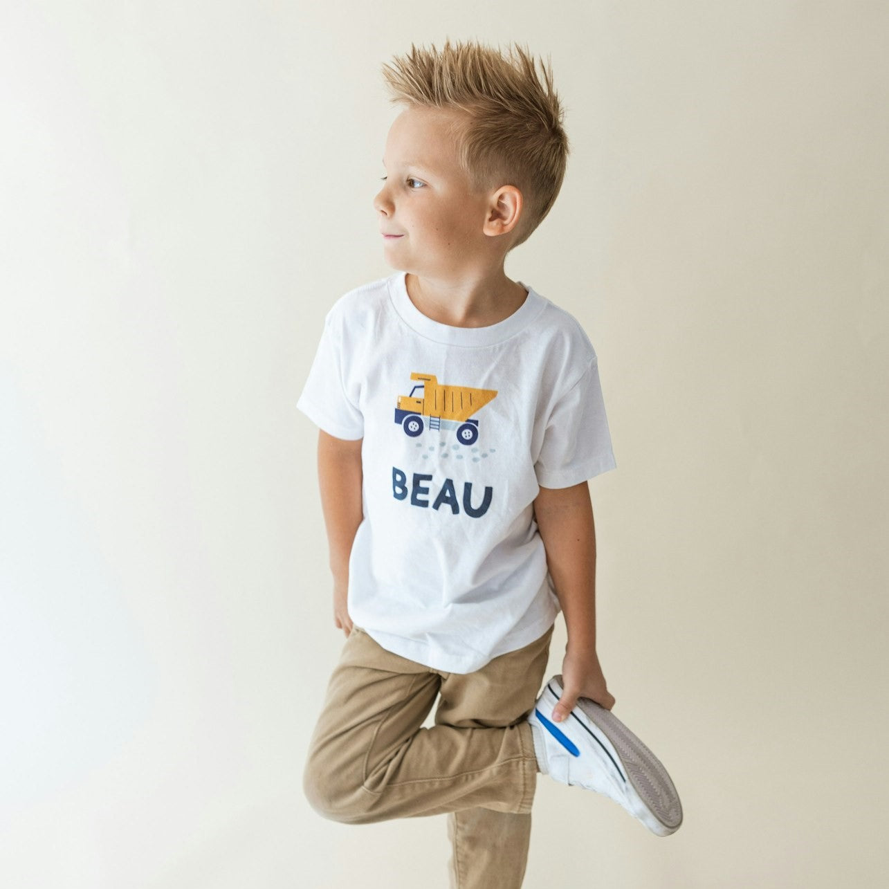 little boy wearing a personalized construction site shirt