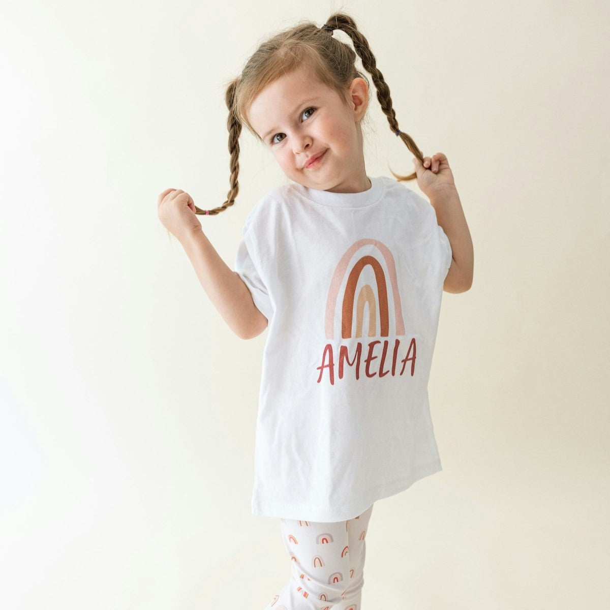 cute girl wearing a rainbow personalized shirt