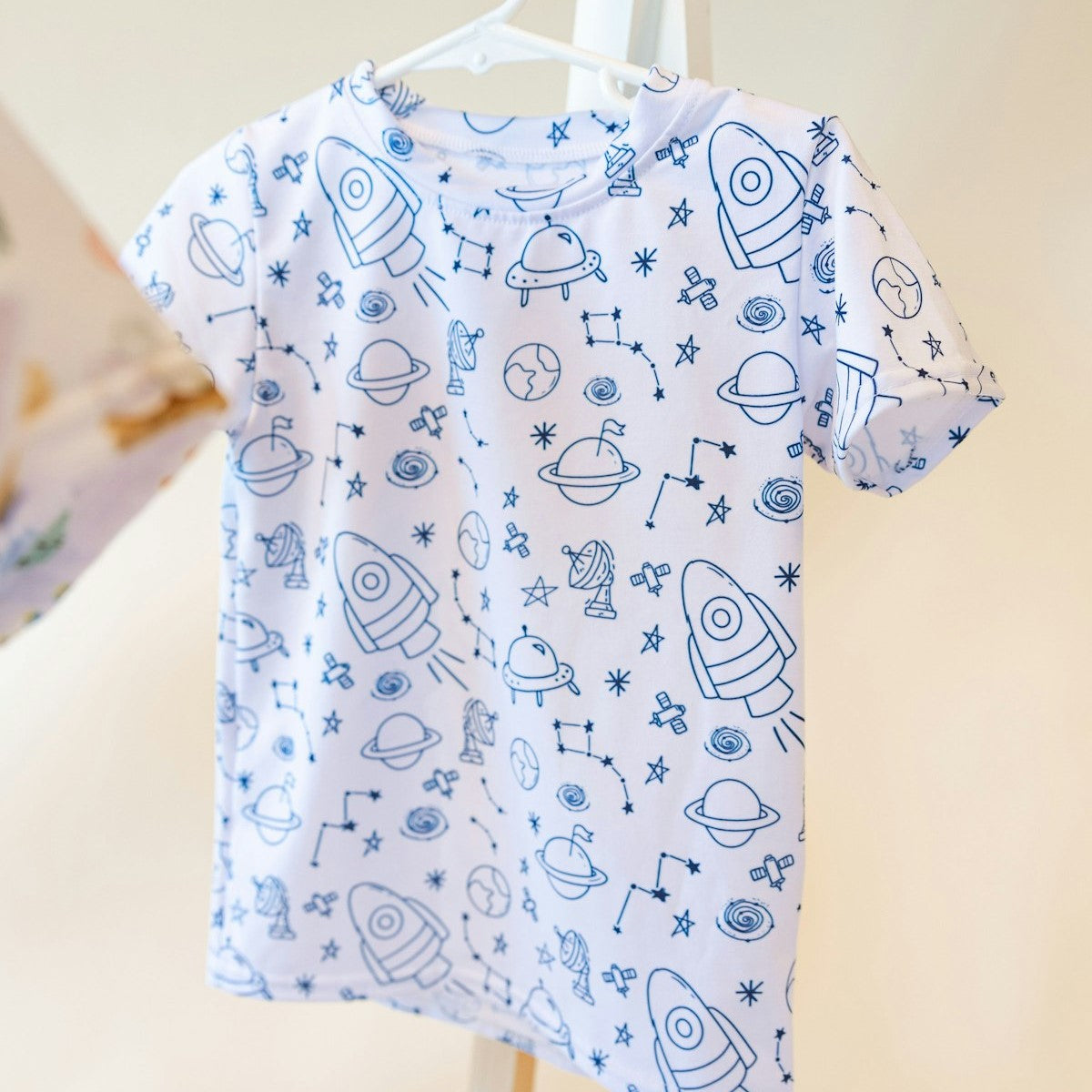 blue and white shirt with space theme