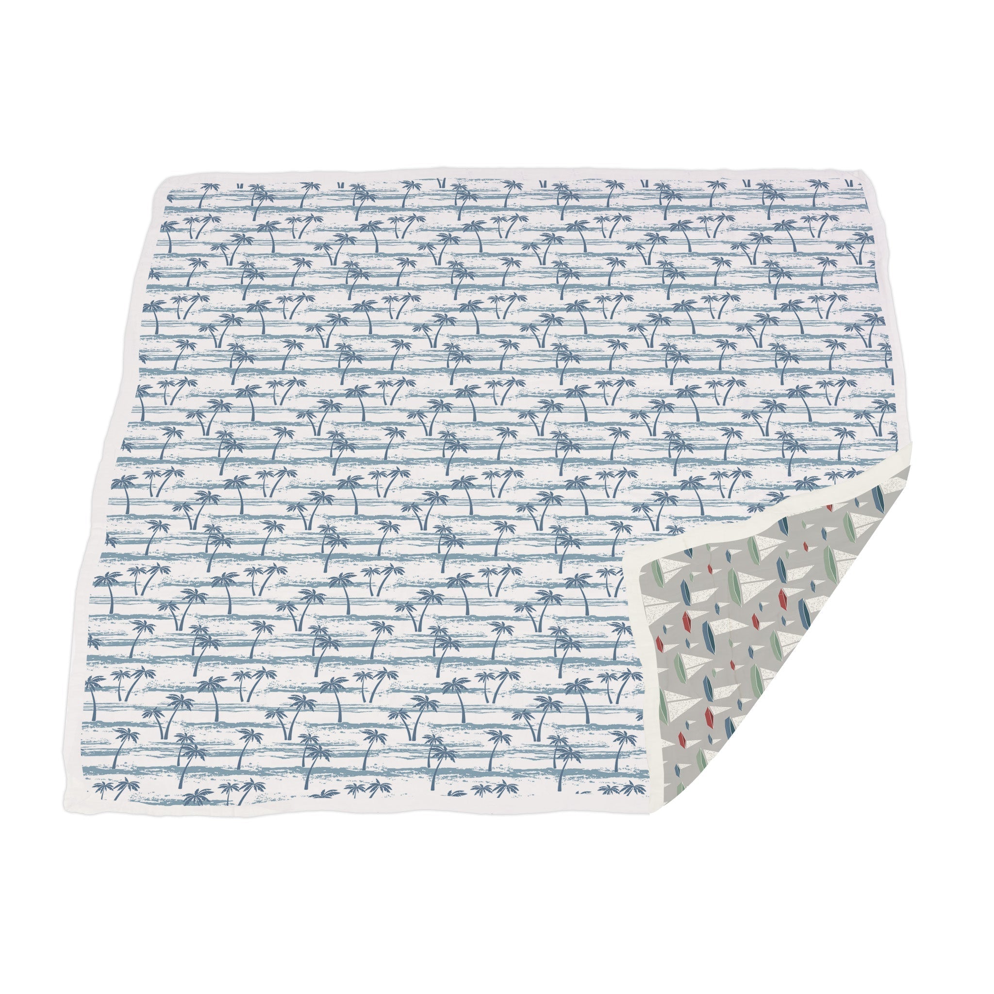 Reversible blanket with palm trees and sail boats